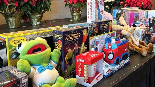 Table of toys at the Holiday Toy Drive to benefit chidern of the Malibu Labor Exchange Workers