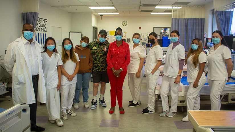Eric Williams (left) and Juliet Carter-Daley (center in red) and Students in SMC CNA Program