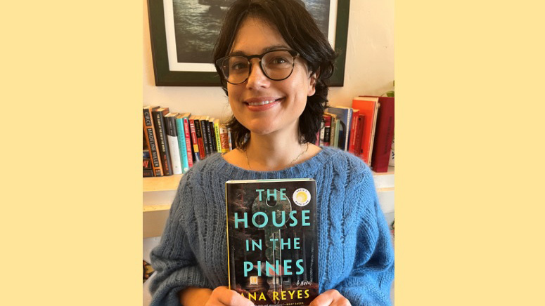 Ana with her book, "The House in the Pines"