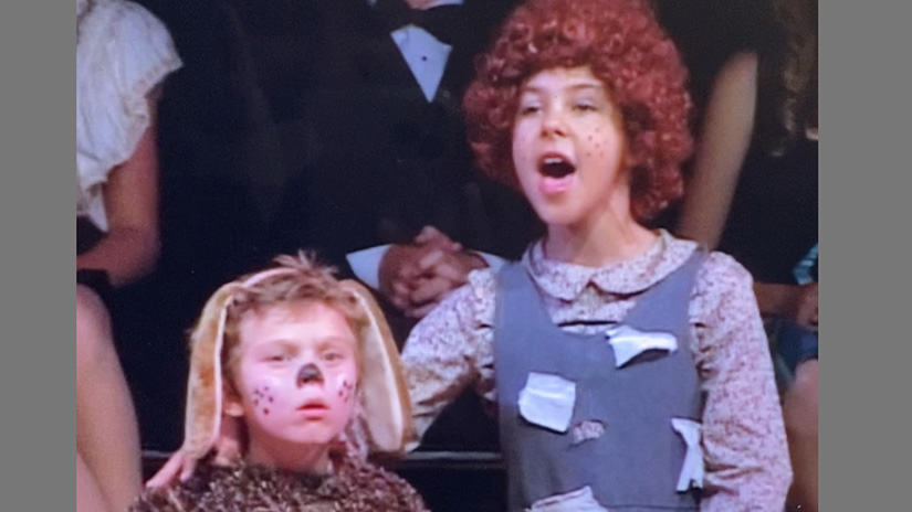 Claire as a third grader in the musical Annie