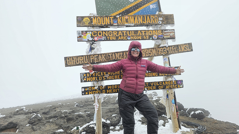 Christyanne Melendez at the summit of Mt. Kilimanjaro