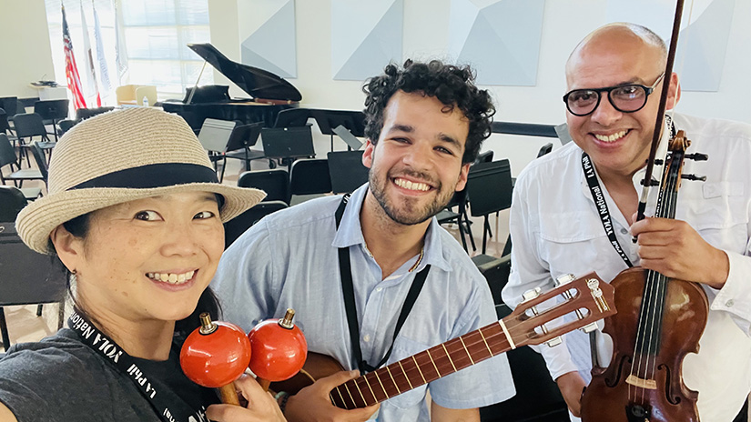 Megumi with maracas and YOLA Festival staff