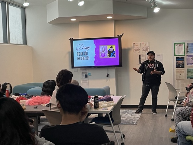 Johnny Gentleman presents to a group in the Student Equity Center